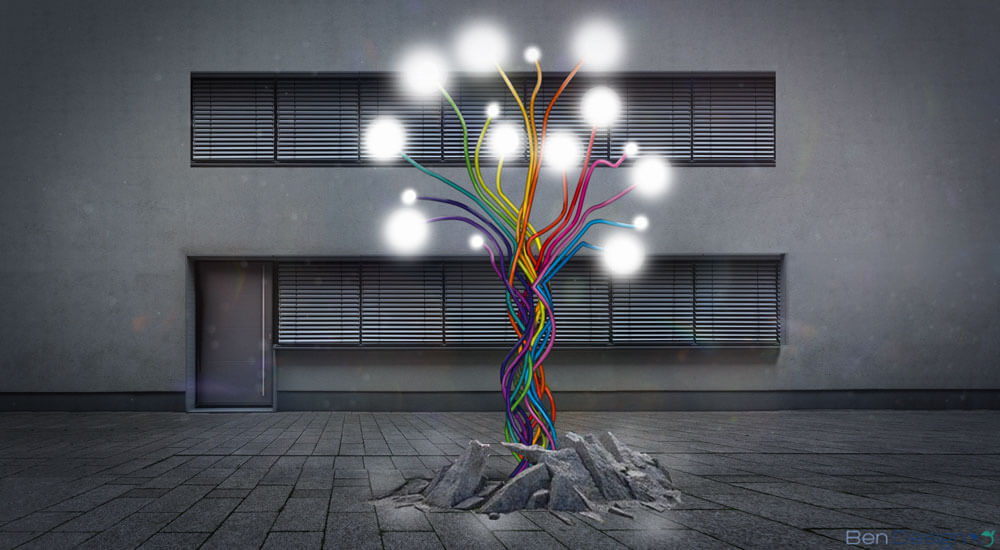 Eine kleinere Skulptur auf dem Vorhof eines Bürogebäudes. Die Enden der Kabelstränge werden illuminiert und weisen dem Betrachter den Weg in eine innovative Zukunft.